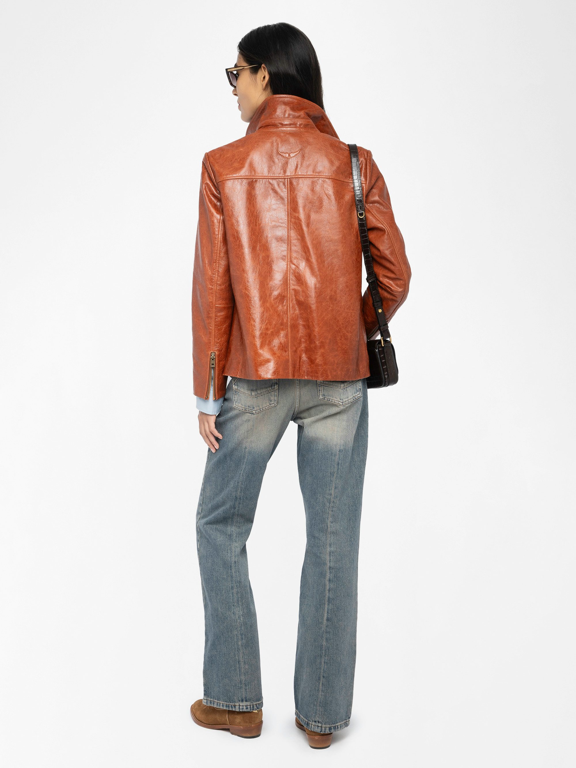 Lienna Leather Jacket - Glossy leather jacket with multiple pockets featuring zip closure and embossed wings on the back.
